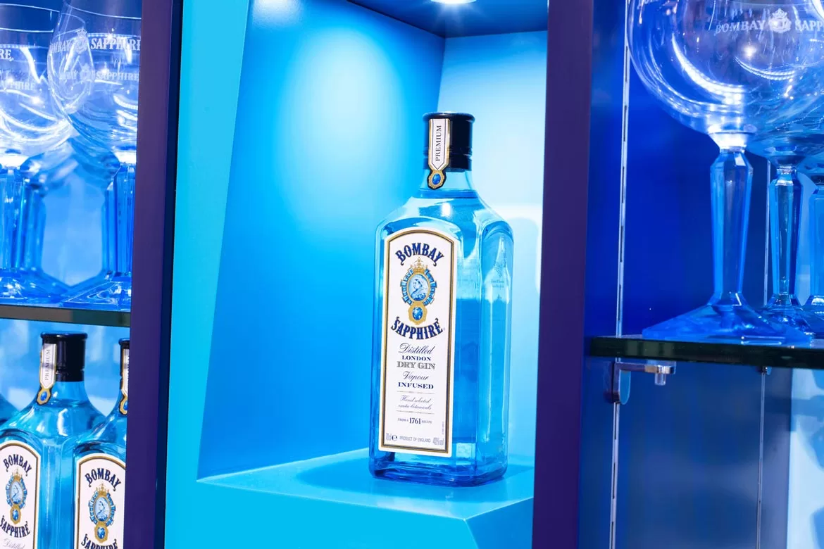 Bombay Sapphire bottle on a rich blue background shot by Bristol Photographer Paris Penny