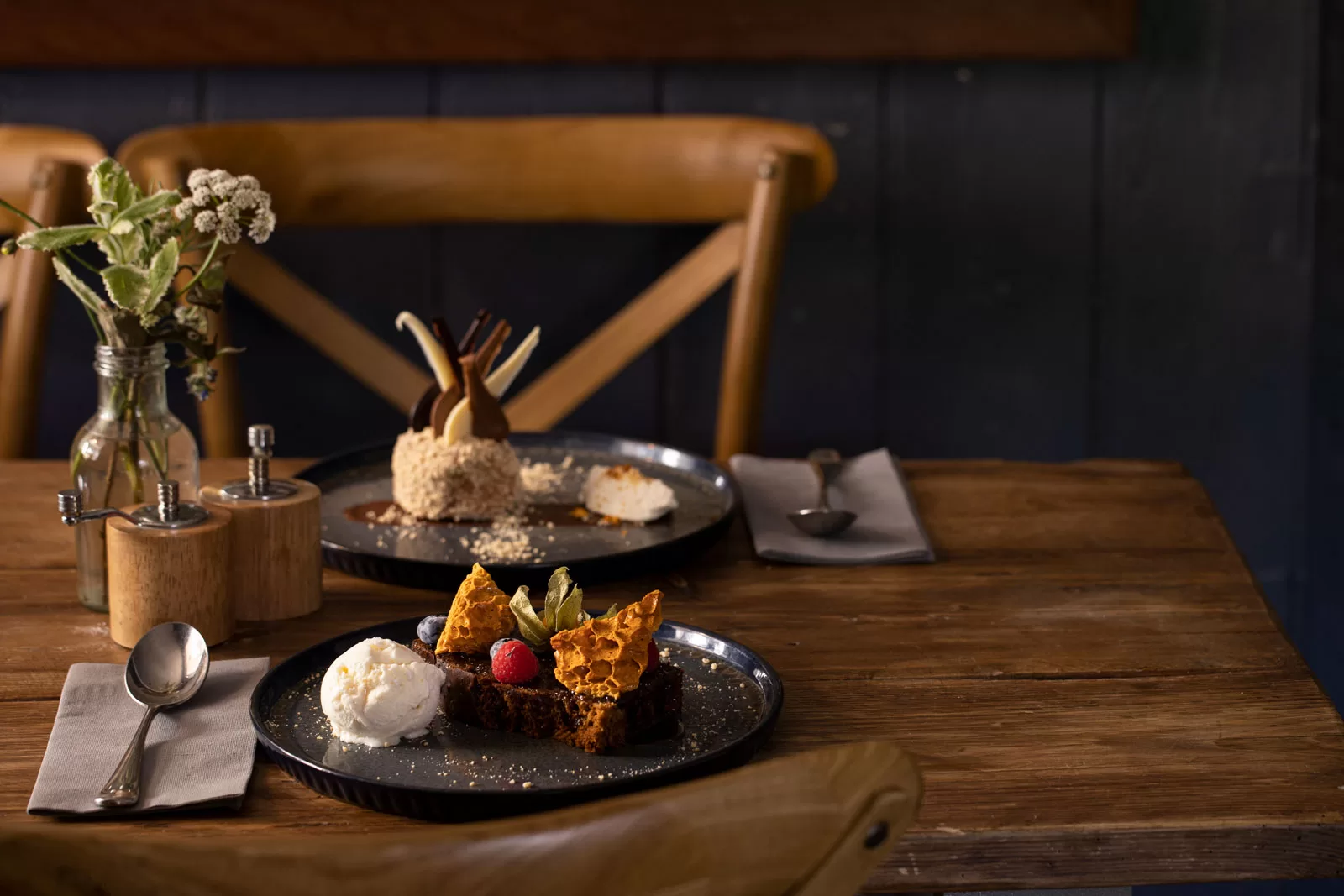 photograph of two delicious puddings on a lovely rustic pub table photographed by Bristol photographer Paris Penny
